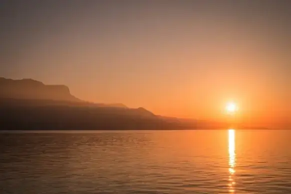 beach boat calm dawn dusk evening lake landscape