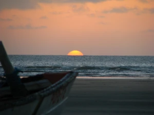 beach boat coast dawn dusk evening horizon island