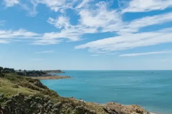 beach coast coastline daytime horizon island