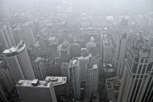 bird8217s eye view of downtown city skyscrapers covered in fog