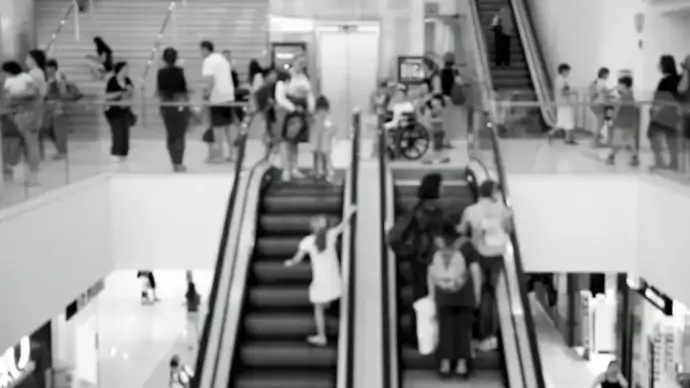 black white clip of crowded trading mall center
