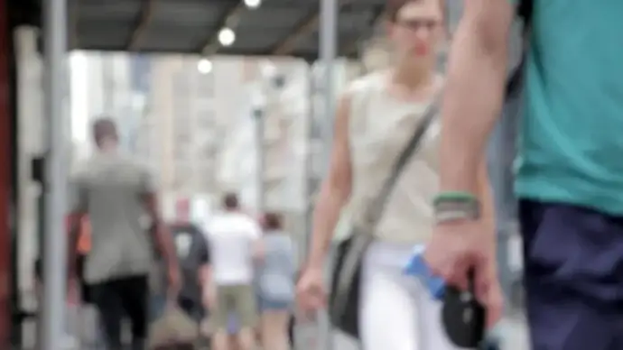 blurred clip of pedestrian walking on road