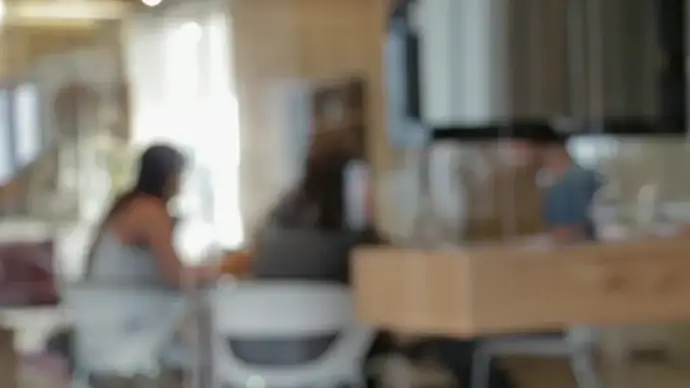 blurred clip of people gathering in room