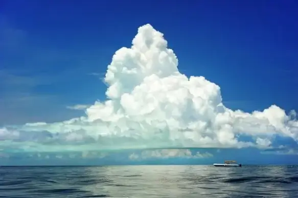 boat under clouds