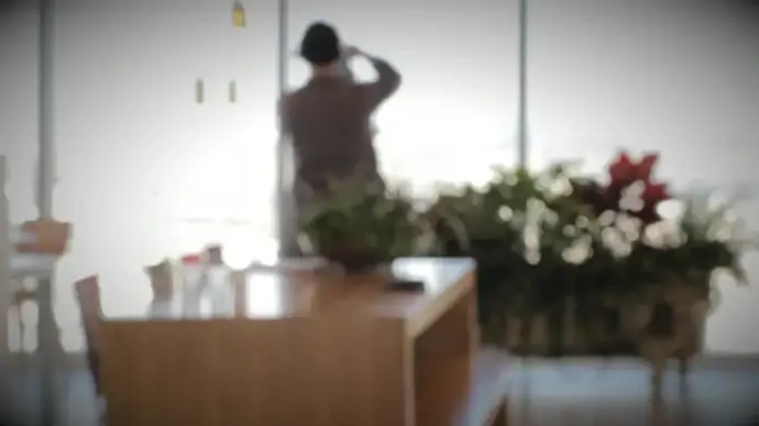 bokeh clip of couple filming room interior