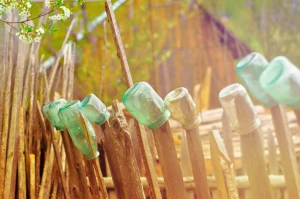 bottle farm fence flower glass jar plant wood