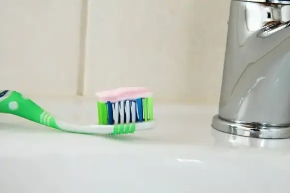 brush with toothpaste