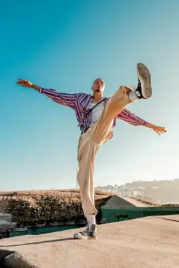 casual male fashion dynamic kicking gesture