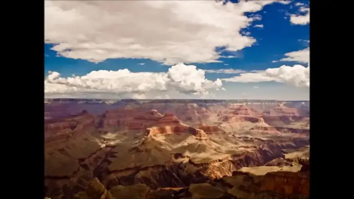 clouds movement above rocky mountain scene