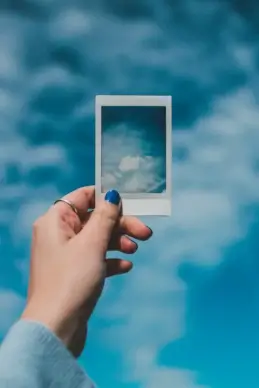 cloudy sky picture hand holding photo