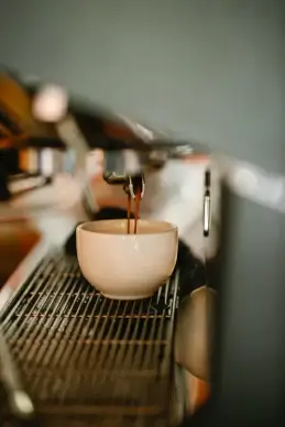 coffee background picture pouring machine cup closeup 