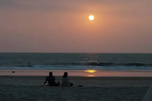 couple on the beach at sunset