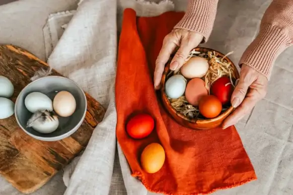 easter preparation picture hands holding eggs