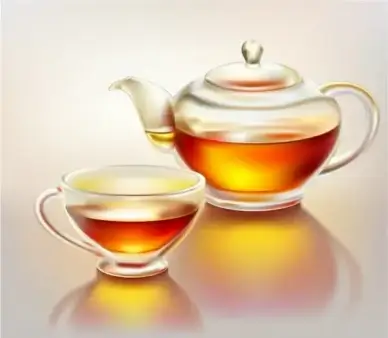 Glass teapot and cup with tea