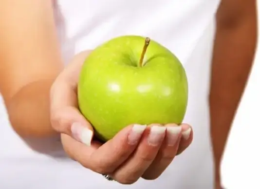 green apple in hand
