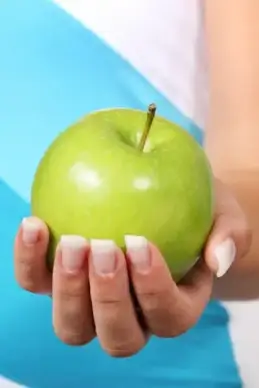 hand holding apple
