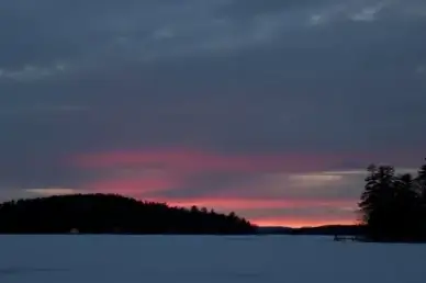lake ice winter sunset clouds trees