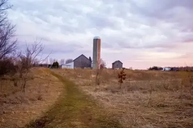landscape with farm and silo in the distance at fonferek glen wisconsin free stock photo