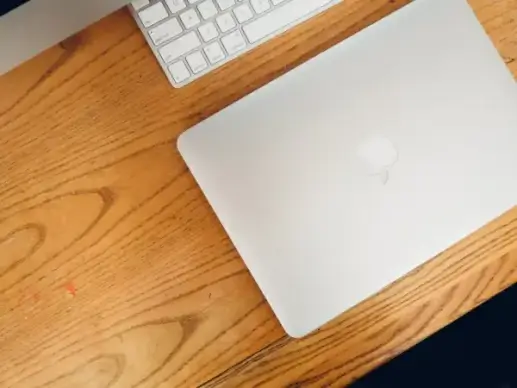 laptop on wooden desk