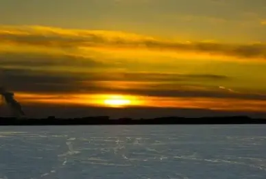 large sunset over snowy mendota in madison wisconsin