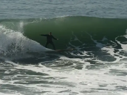 longboarder shoots a curl
