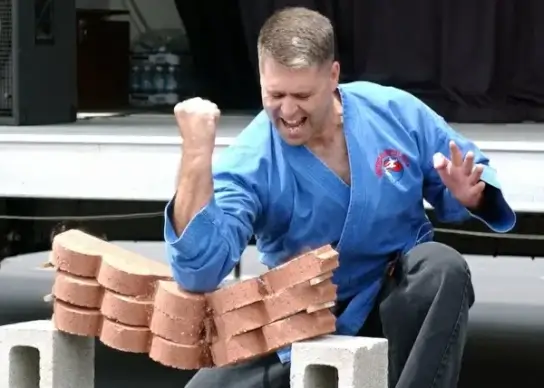 man breaking technique pavers