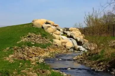 man made waterfall on the military ridge state trail