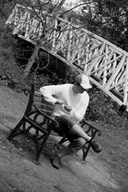 man sitting on bench