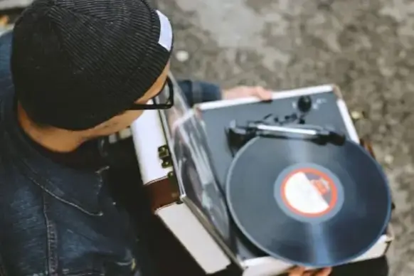 man with record player