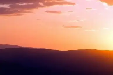 nature landscape sunset sky mountains clouds