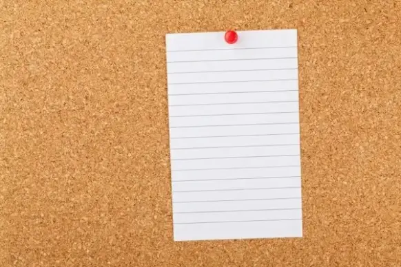 note paper on cork board