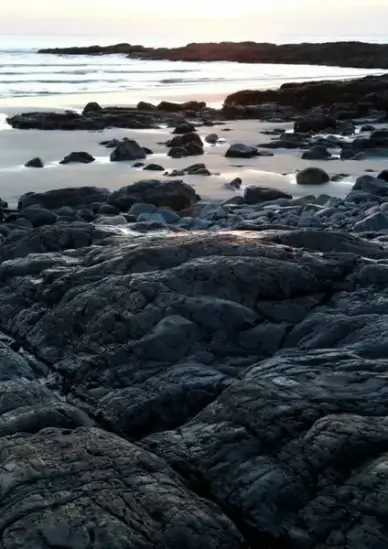 ocean sunrise rocks water seacoast beach