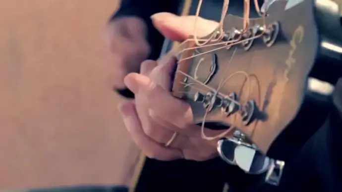 old man excited with guitar and musical instruments