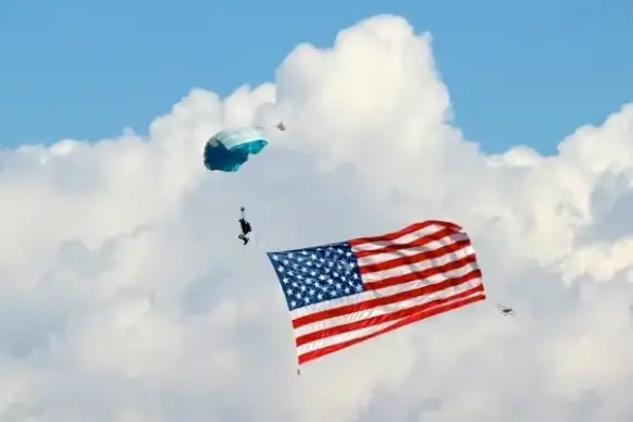 parachute parasailing clouds
