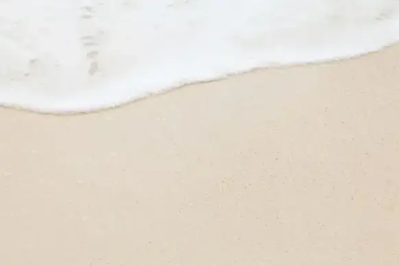 sea foam and sand