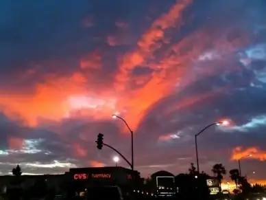 silhouette of street lamps on sunset sky