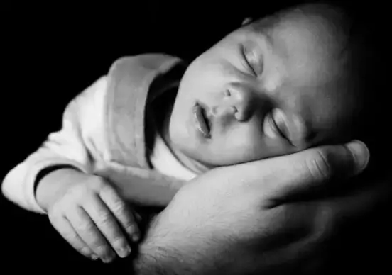 sleeping baby on a hand
