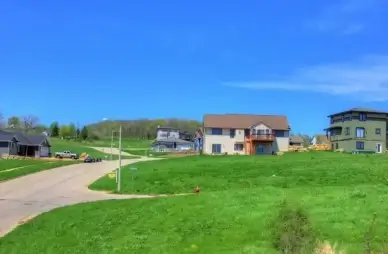 small road and neighborhood on the military ridge state trail