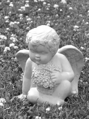 stone cherub with flowers