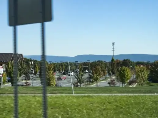 store parking lot with mountains
