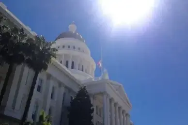 sun over state capital government building