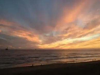 sunset clouds in the sky over the ocean