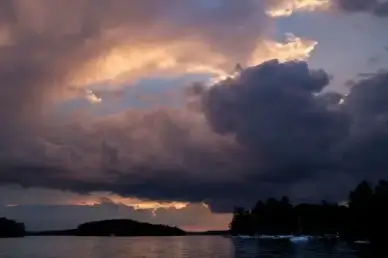 sunset water clouds