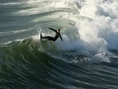 surfer surfing huntington