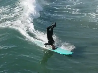 surfer surfing huntington