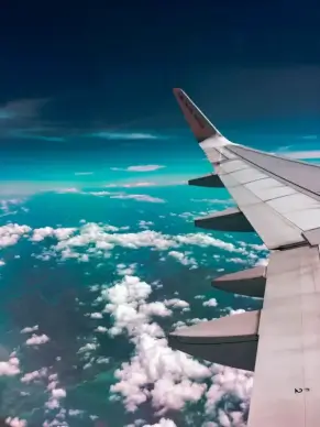 travel backdrop picture airplane wings cloudy sky scene