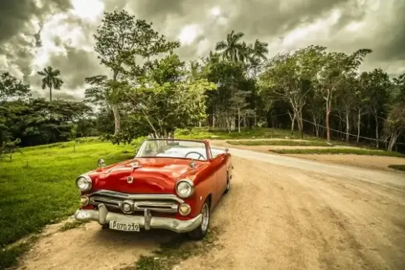 vintage red chevrolet corvette sports car