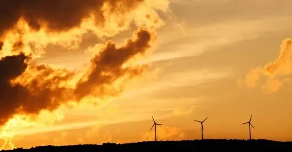 wind turbines at sunset