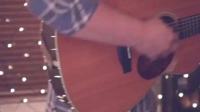 young man excited with guitar performance