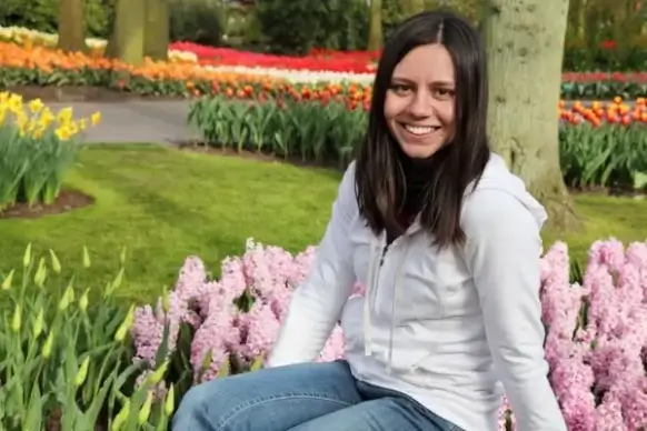 young woman in flower garden